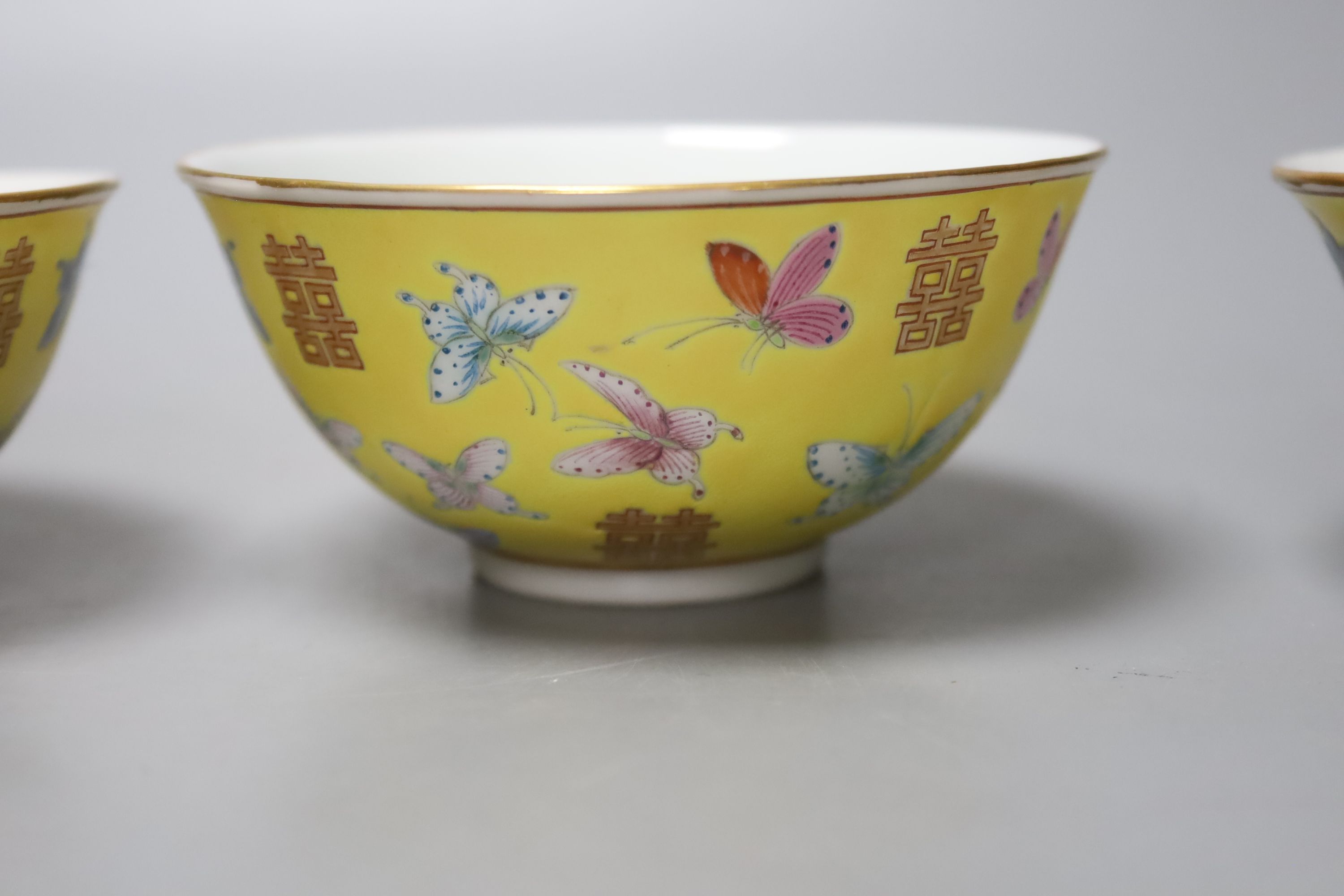 A set of four Chinese yellow ground rice bowls, diameter 11cm